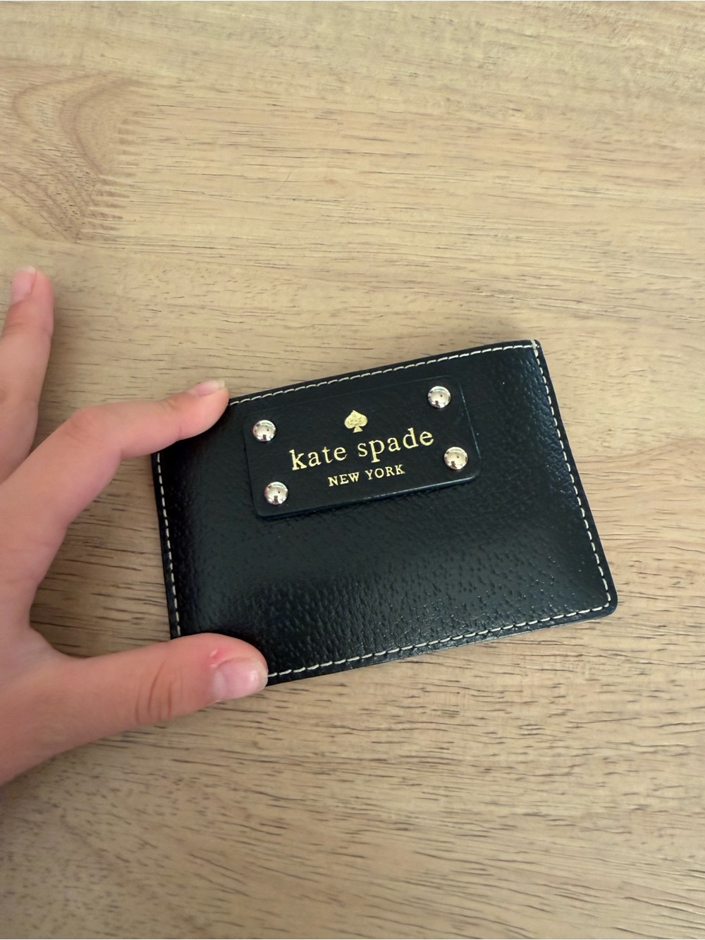 kate spade black leather card case with gold plaque